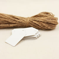 White tags and a rope on a beige background