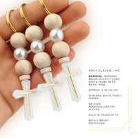 Wooden rosary beads with white pearls and gold crosses held in a hand, with product details on a white background.