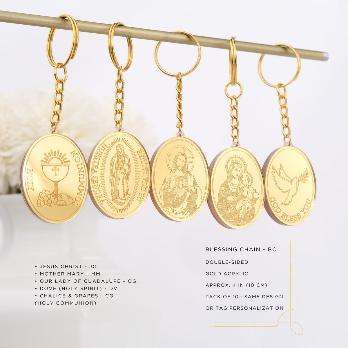 Set of gold keychains with religious designs on a white background baptism party favors