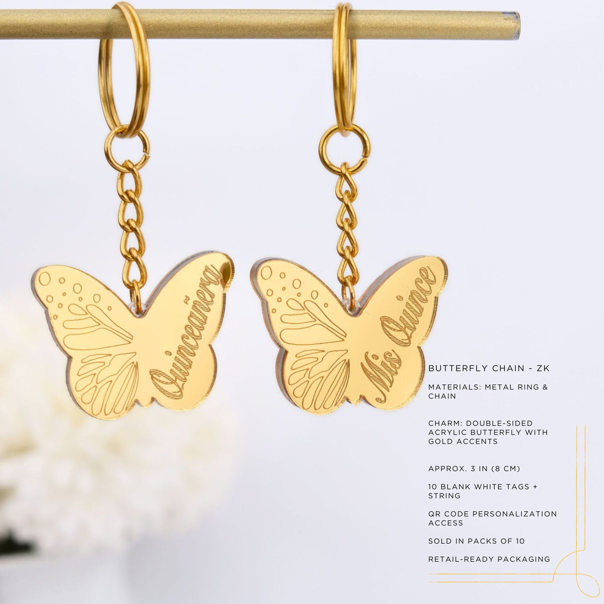 Gold butterfly-shaped keychain favors with 'Quinceanera' text on a white background