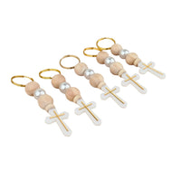 Elegant favor keychains with wooden beads and cross designs on a white background