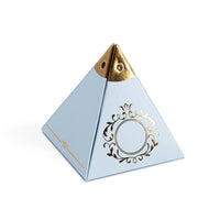 Pyramid-shaped blue favor box with gold accents on a white background