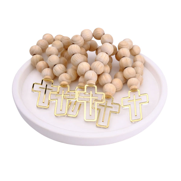 Wooden beaded mini rosaries with gold cross pendants on a white plate