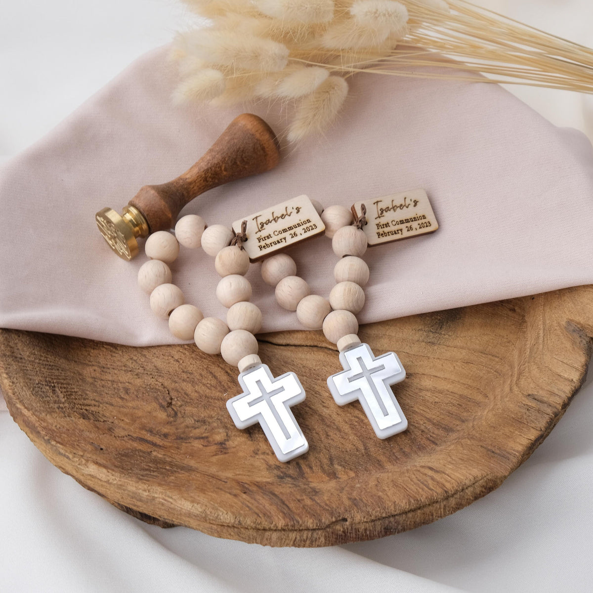 give your baptism guests a gift that is both unique and meaningful, you might love these mini wooden rosaries. They are handmade with natural wood and come in various colors. also customize them with a tag that has the name and date of the baptism.