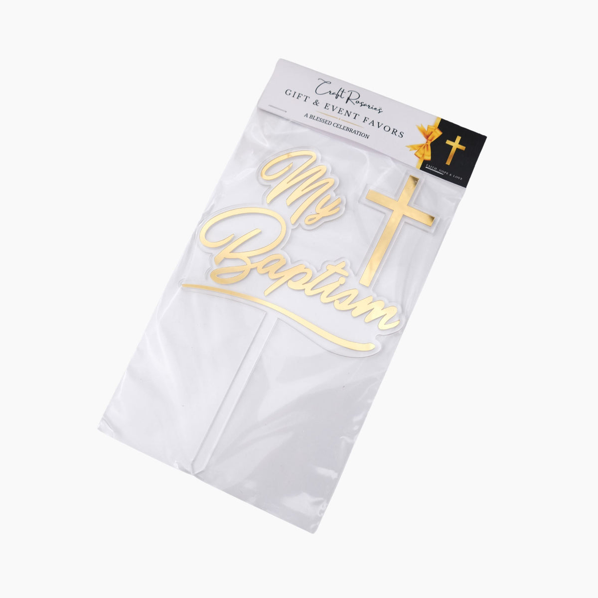 White package with 'My Baptism' text cake topper with gold cross, branded 'Craft Rosaries'.
