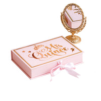 Pink keepsake box with 'Mis Quince' text and a decorative mirror on a white background