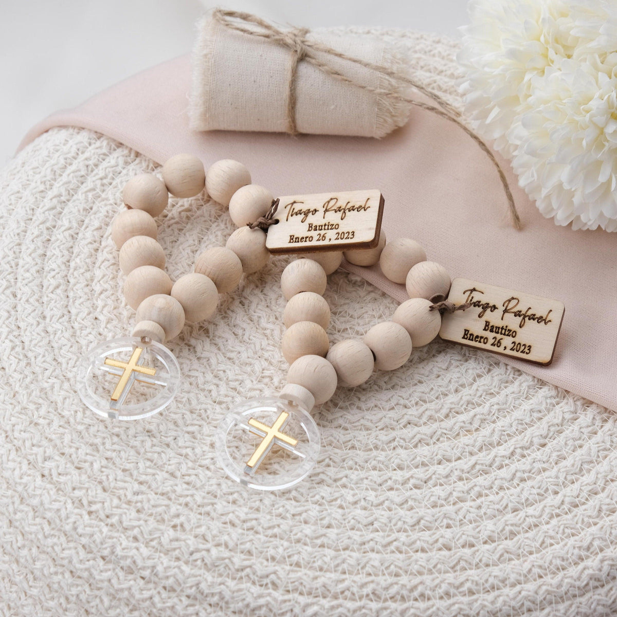 These mini rosaries are handmade with natural wood and come in different cross colors as gold, silver or rose. You can also add a personalized tag with the name and date of the baptism, christening or communion for a special touch.